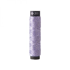 May include: A spool of lavender-colored thread with silver metallic accents. The thread is tightly wound around a black cylindrical base. The top of the spool is black with the number "203" printed in white.