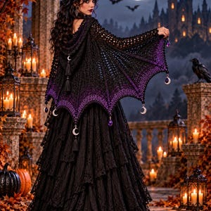 May include: A black and purple crochet hooded shawl with a bat-wing silhouette, featuring dangling silver crescent moon charms and purple teardrop beads along the scalloped hem, paired with a layered black lace skirt. Text reads: CROCHET PATTERN - PDF ONLY.