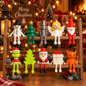 May include: A collection of ten articulated Christmas-themed figurines sitting on a two-tiered wooden shelf. The figures include a snowman, a green tree, a silver nutcracker, an angel, a gnome, a green creature, a tree, Santa, a gift, and a devil.