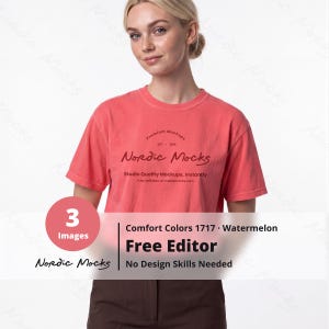 May include: A watermelon-colored short-sleeve t-shirt featuring the text Nordic Mocks, Premium Mockups, Est. 2026, and Studio Quality Mockups, Instantly. The shirt is a Comfort Colors 1717 model, paired with dark brown pants.