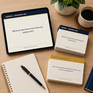 May include: A tablet displaying the text Question Accounting #001 What are the three main financial statements? Prepdeckco.etsy.com, alongside a stack of matching flashcards, a spiral notebook, and a black pen on a wooden surface.