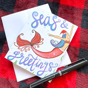 cartão de feriado em branco - mares e saudações - saudações de temporadas - cartão de natal/feriado emoldurado com arte de sereia