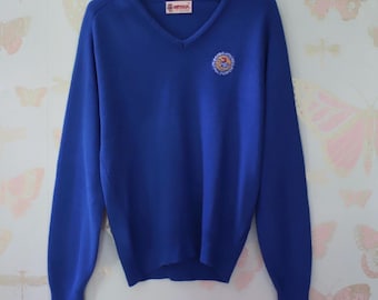 Suéter vintage con cuello en V bordado de los Jayhawks de Kansas City, década de 1980