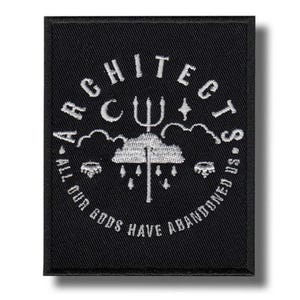 May include: A rectangular black embroidered patch featuring white thread detailing. The design includes a central cloud with a trident, a crescent moon, a star, and the text ARCHITECTS and ALL OUR GODS HAVE ABANDONED US in a circular layout.