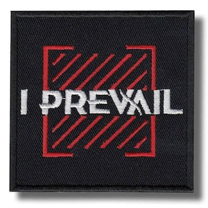 May include: A square black embroidered patch featuring the white text I PREVAIL centred horizontally. The design includes a red rectangular frame with diagonal red lines running through the background behind the white lettering.