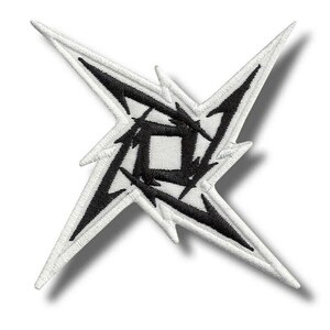 May include: A four-pointed star-shaped embroidered patch featuring a white background with a bold black jagged, thorn-like design radiating from a central square. The edges of the star are defined by white stitching, creating a sharp, geometric look.