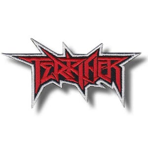 May include: An embroidered patch featuring the word TERRIFIER in a sharp, angular, red font with a black background and a white border. The design has a jagged, star-like shape with multiple points extending outward from the central lettering.