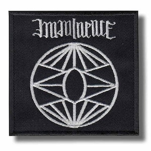 May include: A square black embroidered patch featuring white stitching. The top portion displays the text Imminence in a stylized gothic font. Below the text is a circular geometric design composed of radiating lines and a central oval shape.