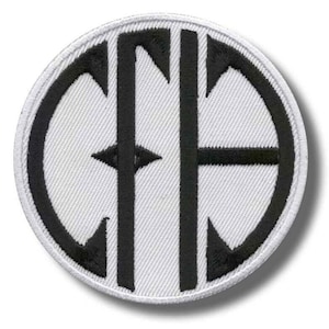 May include: A circular embroidered patch featuring a white background with a thick black border. The center displays the black embroidered letters CFD in a stylized, interconnected monogram font, with the letters enclosed within a circular frame.
