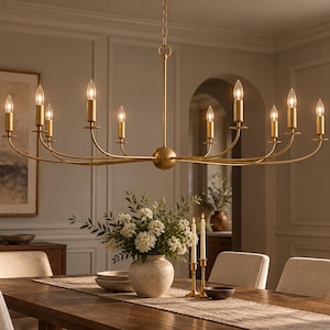 May include: A linear chandelier in a brushed gold finish featuring ten vertical candle-style light sockets arranged along a slender, horizontal metal frame. The fixture is suspended by a central chain and includes ten white candle-shaped bulbs.