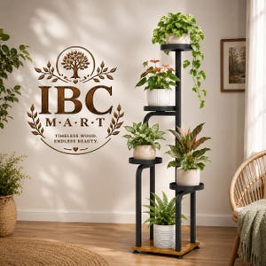 May include: A black metal plant stand with five circular tiers holding various potted plants, including a trailing pothos, an anthurium, and a fern. The stand features a wooden base and a vertical frame, positioned near a wall with a brown logo.