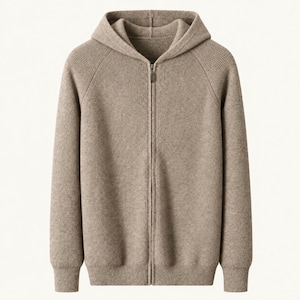 May include: A light brown, long-sleeved, full-zip hoodie made of a knit fabric. The garment features a hood, a central metal zipper closure, and ribbed cuffs at the sleeves and hem. The knit texture is consistent throughout the entire piece.