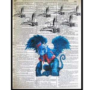May include: A whimsical art print featuring a blue monkey-like creature with large blue wings, set against a backdrop of vintage dictionary pages. The artwork has a vintage aesthetic.