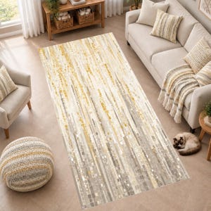 May include: A rectangular area rug featuring an abstract vertical pattern in shades of gold, yellow, beige, and gray. The design consists of varied rectangular shapes and linear streaks that create a textured appearance across the entire surface.