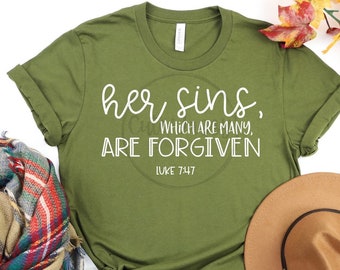 May include: Olive green t-shirt with white text that reads "her sins, which are many, are forgiven Luke 7:47".