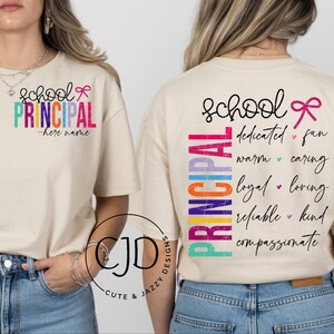 May include: A natural-coloured t-shirt featuring a front chest graphic that reads school PRINCIPAL -here name with a pink bow. The back displays the word PRINCIPAL vertically in rainbow colours alongside the words dedicated, fun, warm, caring, loyal, loving, reliable, kind, and compassionate.