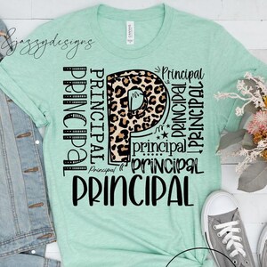 May include: A mint green t-shirt with the word "Principal" in various fonts and styles. The letter "P" features a leopard print design. A light blue denim jacket and grey trainers are also in the image.