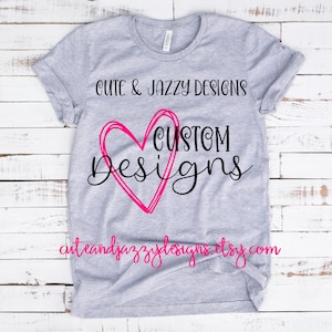 May include: Grey t-shirt with a pink heart and the text "Cute & Jazzy Designs Custom Designs cuteandjazzydesigns.etsy.com"