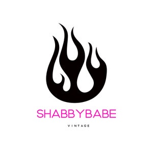 May include: Black and white logo with a stylized flame design. The text "SHABBYBABE VINTAGE" is below the flame.