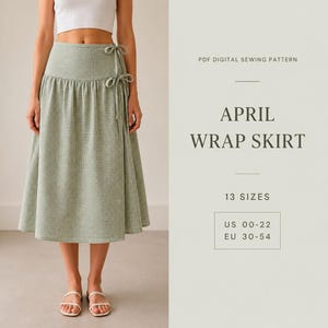 Pode incluir: Uma saia envelope com padrão xadrez verde e branco e fecho de laço lateral. O texto diz: PDF DIGITAL SEWING PATTERN, APRIL WRAP SKIRT, 13 SIZES, US 00-22, EU 30-54. A saia apresenta cintura alta e uma silhueta evasê abaixo do joelho.