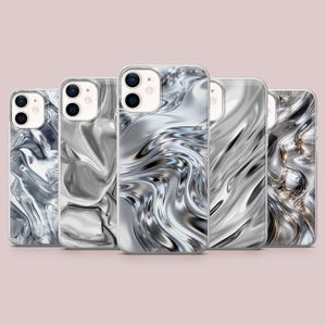 May include: Five smartphone cases arranged in a row, each featuring a distinct liquid metal design. The patterns consist of swirling, reflective silver and grey waves that create a high-gloss, chrome-like appearance across the back of each case.