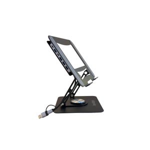 May include: A black adjustable metal tablet stand with a rotating base and a built-in USB-C hub featuring multiple ports along the side. The stand holds a silver tablet at an angle and includes a connected USB cable extending from the base.