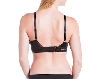 May include: Black bra and underwear set with the word "TomboyX" on the back of the bra.