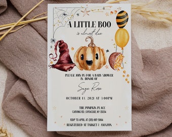 May include: A Halloween-themed baby shower invitation with a pumpkin and witch hat illustration. The invitation reads "A Little Boo is almost due" and includes the date, time, and location of the event. It also includes the name of the guest of honor, Sage Rose, and the RSVP information. The invitation states that the event is registered at Target and Amazon.