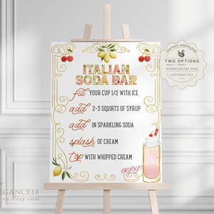 May include: A printable sign for an Italian soda bar with instructions on how to make the drink. The sign features a gold frame with lemons, cherries, and a glass of pink soda with whipped cream.