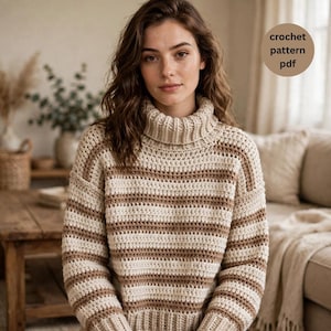 May include: A long-sleeved crochet sweater featuring a high turtleneck collar and horizontal stripes in alternating shades of cream and light brown. The garment has a textured knit construction and includes a circular graphic with the text crochet pattern pdf.