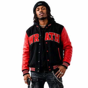 May include: A black varsity jacket with red leather sleeves and red striped ribbed cuffs. The word W R A T H is embroidered in red block letters across the chest. The jacket features a black hood, a snap button front closure, and red accents.