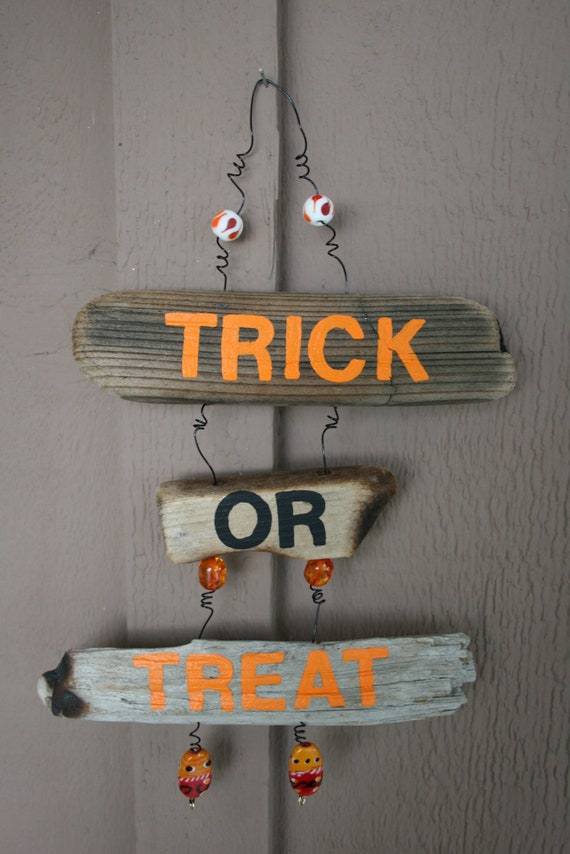 Items similar to TrickorTreat Halloween Driftwood Art with orange and