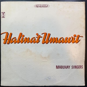 May include: A white vinyl record album cover with the title "Halinat Umawit" in orange text. The album is by the "Mabuhay Singers".