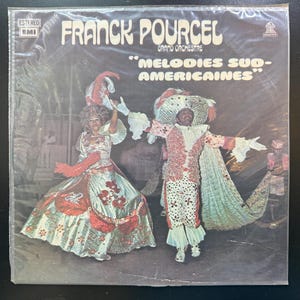 May include: A vintage vinyl record cover featuring a colorful illustration of two people in carnival costumes. The text on the cover reads "Franck Pourcel Grand Orchestre "Melodies Sud-Americaines""