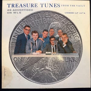 May include: Vintage vinyl record album cover for "Treasure Tunes From The Vault" as advertised on WLS. The cover features a group of men in suits, set against a large coin design. The text "UNITED STATES OF AMERICA" is visible.