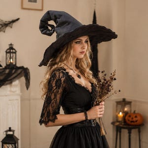 May include: A tall, pointed black witch hat with a wide, slightly drooping brim, crafted from a textured fabric. The hat features a structured, conical crown that curves at the top, providing a classic silhouette for a costume or themed ensemble.