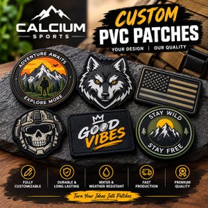 May include: A collection of five custom PVC patches featuring various designs including a mountain landscape with the text ADVENTURE AWAITS EXPLORE MORE, a wolf head, a US flag, a skull in a tactical helmet, and a mountain scene with STAY WILD STAY FREE.