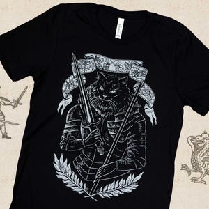 Vitória - Camiseta com estampa de tela - Armadura medieval de guerreiro gato Joana d&#39;Arc