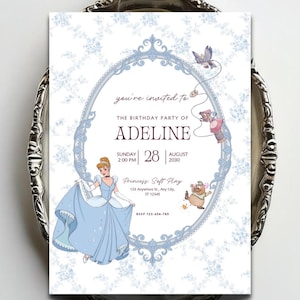 May include: A rectangular birthday party invitation featuring a light blue floral background and a central ornate blue oval frame. The text reads you're invited to the birthday party of Adeline, Sunday 2:00 PM, 28 August 2030, Princess Soft Play, 123 Anywhere St., Any City, ST 12345, RSVP 123-456-789. It includes illustrations of a character in a blue gown and three small mice.