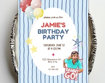 May include: A rectangular birthday party invitation featuring a light blue background with vertical dark blue stripes. It displays colorful balloons, yellow stars, and text reading: please join us for JAMIE'S BIRTHDAY PARTY, SATURDAY, JUNE 12 AT 4:00 PM, 123 Anywhere St., Any City, RSVP 123-456-789, and DANNY GO! with a person wearing goggles.