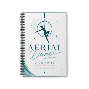 May include: A spiral-bound notebook with a white cover featuring a dark teal silhouette of an aerialist on a hoop. The text reads AERIAL DANCE SHOW NOTES, IDEAS, CHOREOGRAPHY, CONNECTION. The design includes teal and gold star accents and a teal swirl.