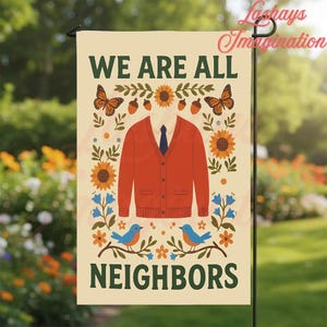 May include: A rectangular garden flag with a cream background featuring the text WE ARE ALL NEIGHBORS in dark green. The design includes a red cardigan with a blue tie, surrounded by illustrations of butterflies, sunflowers, acorns, and blue birds.