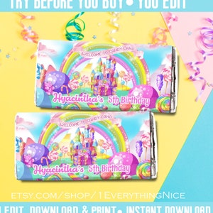May include: Two candy bar wrappers with a colorful Candy Land design. The wrappers feature a rainbow, a castle, and various candies. Text includes "Welcome to Candy Land" and "Hyacintha's 5th Birthday." The image also includes the text "Try Before You Buy You Edit."