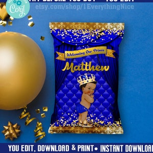 May include: A blue and gold chip bag template for a baby shower. The bag features a royal blue background with a gold crown and a baby boy wearing a gold crown. The text on the bag reads "Welcoming Our Prince Matthew".
