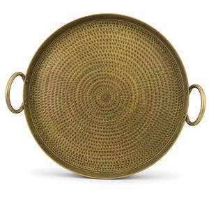 May include: A round brass tray with a hammered texture featuring a spiral pattern across the surface. The tray has a raised rim and two circular handles attached to opposite sides, providing a metallic finish with a warm golden-brown color.
