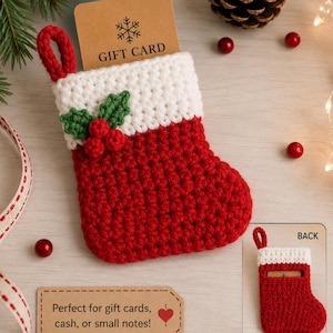 May include: A small red and white crocheted Christmas stocking with a hanging loop, decorated with green leaves and red berries. A tan card labeled GIFT CARD is tucked inside. A small inset shows the back with a card slide pocket for storage.