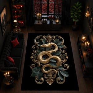 May include: A rectangular black area rug featuring a central gold-coloured snake coiled amidst dark green leaves and intricate gold scrollwork. The design is symmetrical, with ornate filigree patterns extending from the top and bottom of the snake.