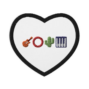 May include: Embroidered heart-shaped patch with a black border. The patch features a ukulele, a red circle, a green cactus, and a piano keyboard. The design is in orange, red, green, and blue on a white background.