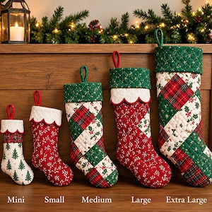 May include: Five quilted Christmas stockings in mini, small, medium, large, and extra-large sizes. The stockings feature red, green, and white fabric with patterns of holly, plaid, and pine trees, finished with scalloped cuffs and hanging loops.