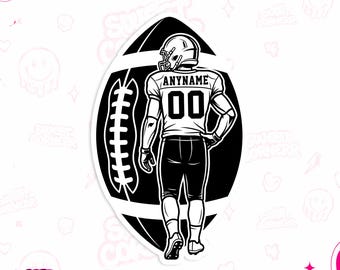 May include: A black and white sticker featuring a football player wearing a helmet and jersey with the text ANYNAME and the number 00, positioned in front of a large football graphic with white laces and stripes on a black background.
